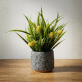 Stone Pot Potted Grass with Yellow Blooms