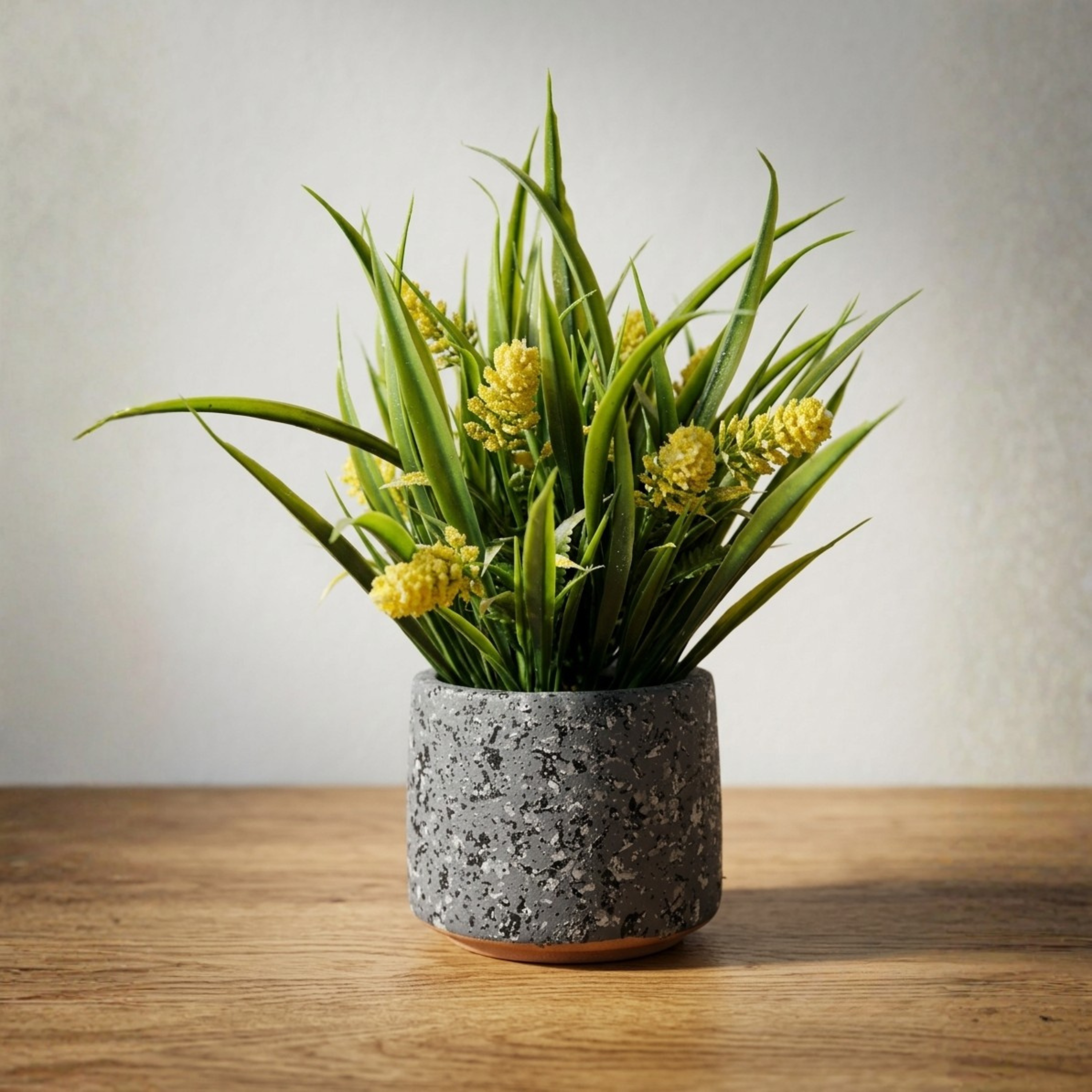 Stone Pot Potted Grass with Yellow Blooms