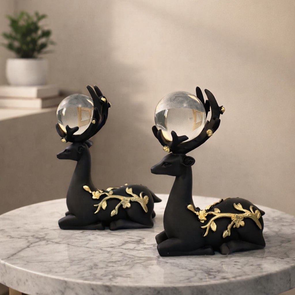 Set Of Two Elegant Reclining Deer Figurine Set with Crystal Orb.