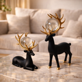 SET OF Two  Minimalist Matte Black Deer Sculptures with Golden Antlers .